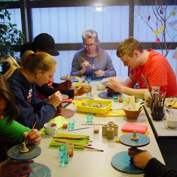 Decorating a spinning whorl in the table-wheel Undergraduate students in archaeology, Bucknell University