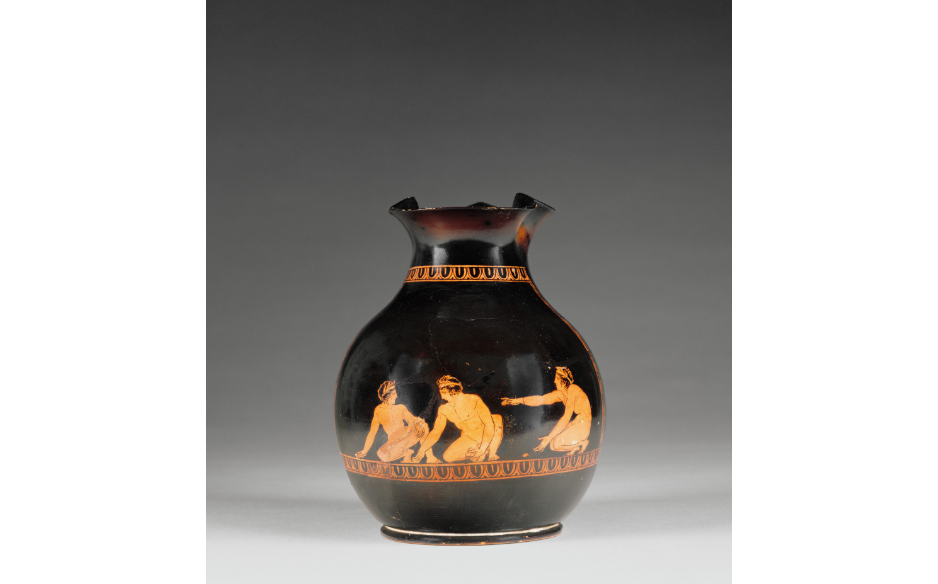 Three boys wearing leafy crowns play knucklebones on an Athenian red-figure oinochoe by The J. Paul Getty Museum