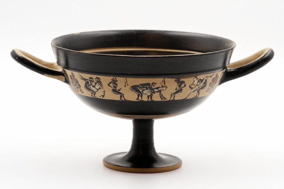 Ancient Greek kylix featuring miniature erotic scenes, commonly associated with symposium use and classical pottery art.