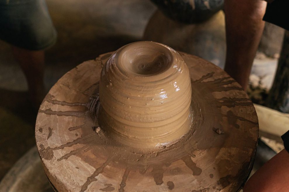 clay forming on a spinning pottery wheel during traditional ceramic making