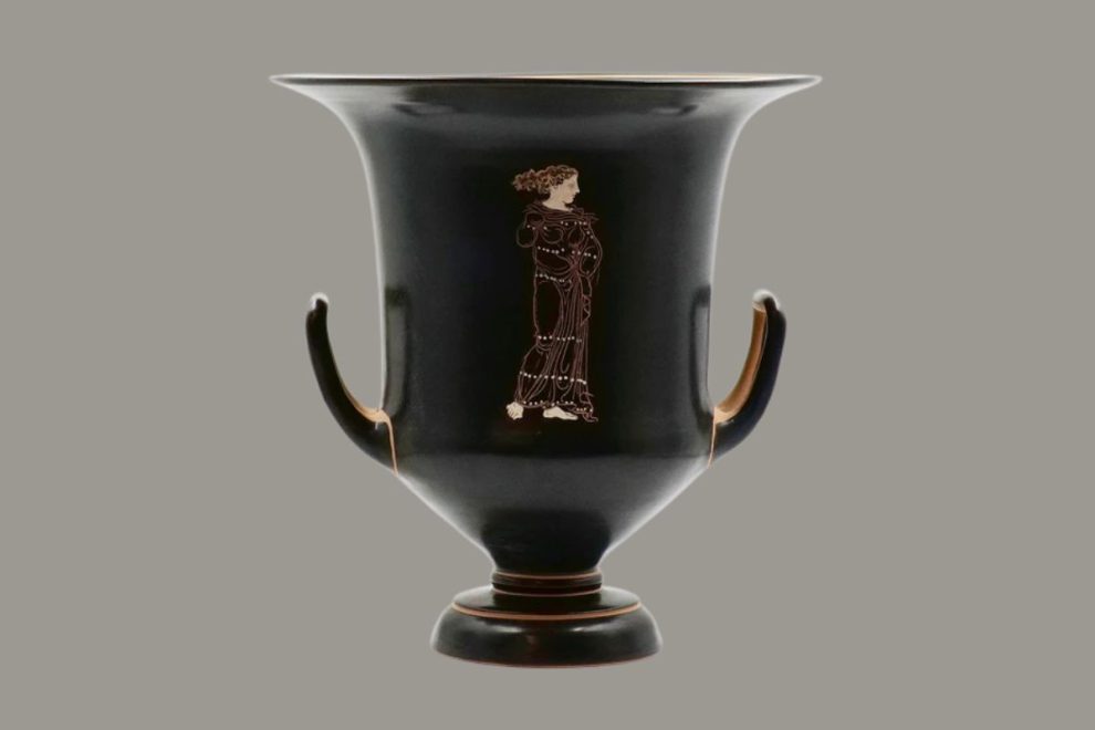 Ancient South Italian krater with red-figure decoration of a standing female figure.