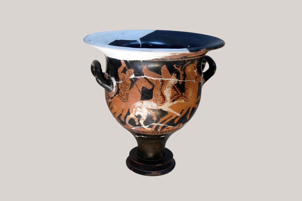 Ancient Greek red-figure pottery krater depicting warriors on horseback.