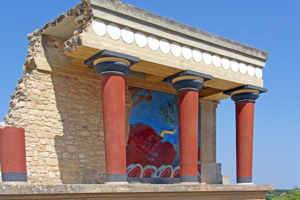 Minoan palace ruins at Knossos in Crete with ancient fresco and columns