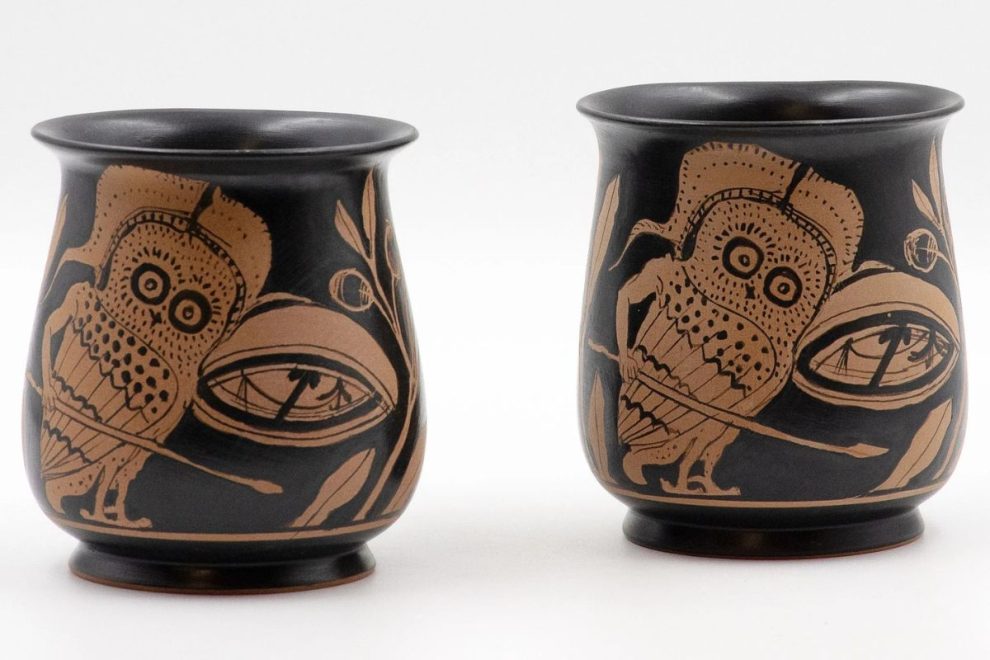 Attic red figure vase painters design with owl motif in ancient Greek pottery.