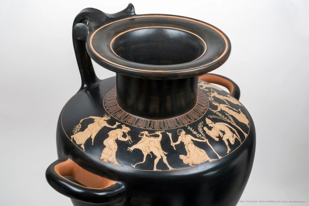 Ancient Greek hydria with red-figure design showing mythological and festive scenes on a black-glazed surface.