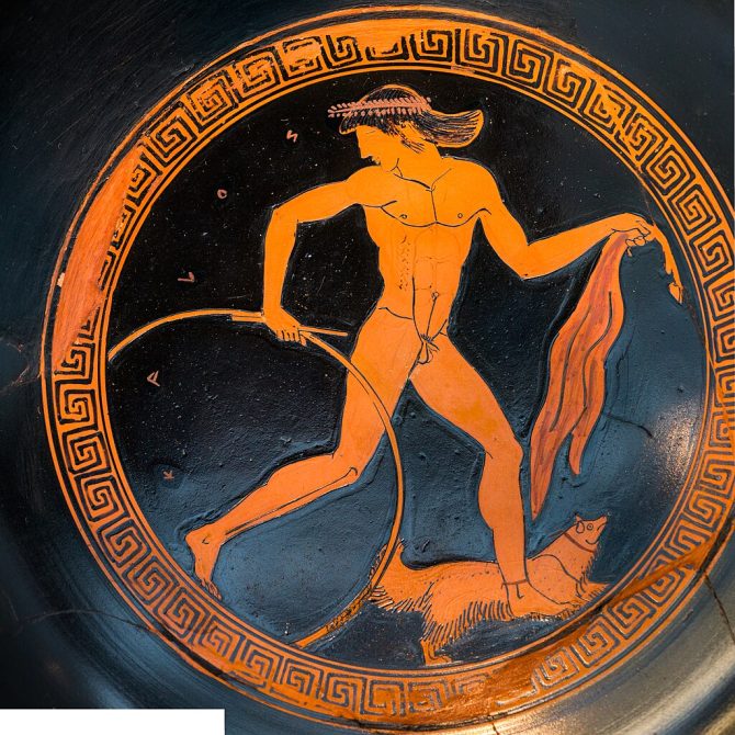 Attic red-figure kylix attributed to the Makron vase painter showing a running youth with a hoop and a dog. 